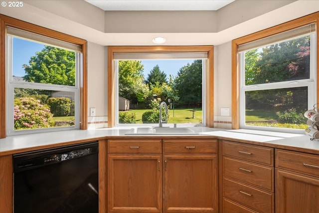 601 NW 110th Way, Vancouver, WA 98685 - kitchen featuring dishwasher, light countertops, and brown cabinetry