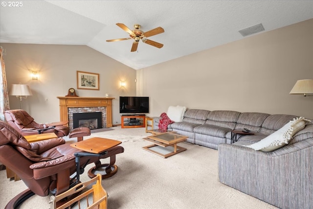 601 NW 110th Way, Vancouver, WA 98685 - living area with carpet floors, a ceiling fan, vaulted ceiling, and a tile fireplace