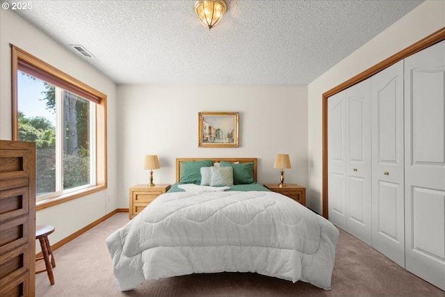 601 NW 110th Way, Vancouver, WA 98685 - bedroom with carpet flooring, multiple windows, a textured ceiling, and a closet