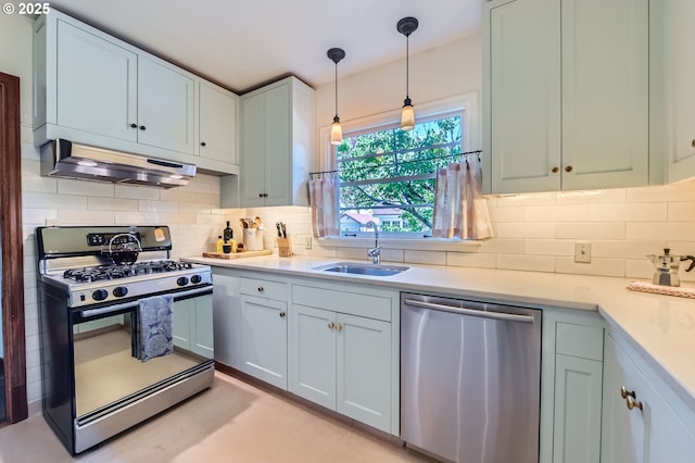 1834 SE 20th Ave, Portland, OR 97214 - kitchen with dishwasher, gas range, under cabinet range hood, backsplash, and light countertops