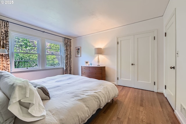 1834 SE 20th Ave, Portland, OR 97214 - bedroom with light wood-style flooring and baseboards