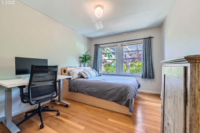 1834 SE 20th Ave, Portland, OR 97214 - bedroom with light wood-style floors and crown molding
