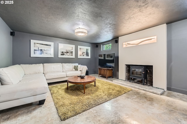 1834 SE 20th Ave, Portland, OR 97214 - living area featuring finished concrete flooring, a wood stove, and a textured ceiling