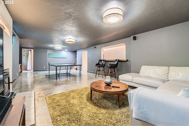1834 SE 20th Ave, Portland, OR 97214 - living area with concrete flooring and a textured ceiling
