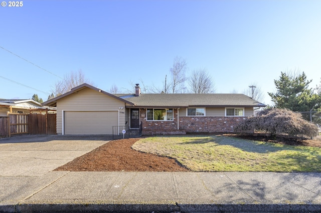 ranch-style home with a garage and a front lawn