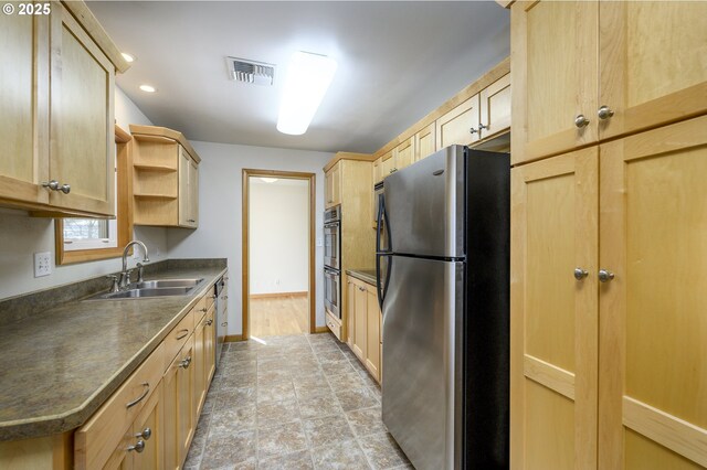 1736 NE Hembree St, Mcminnville, OR 97128 - kitchen featuring appliances with stainless steel finishes, light brown cabinets, a sink, dark countertops, and open shelves