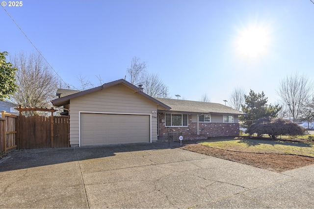 1736 NE Hembree St, Mcminnville, OR 97128 - ranch-style house featuring driveway, fence, an attached garage, and brick siding