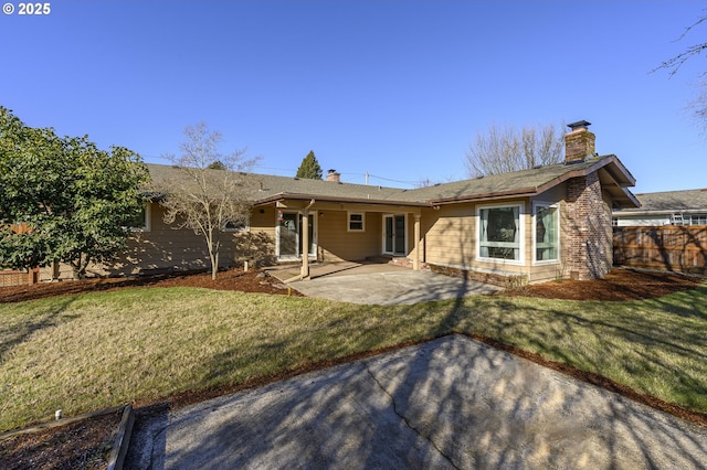 1736 NE Hembree St, Mcminnville, OR 97128 - back of property with a patio area and a chimney