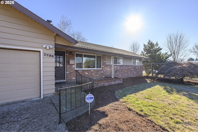 1736 NE Hembree St, Mcminnville, OR 97128 - doorway to property with brick siding and roof with shingles