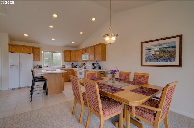 315 5th St NW Unit 101, Long Beach, WA 98631 - dining room with recessed lighting, light carpet, high vaulted ceiling, and light tile patterned floors