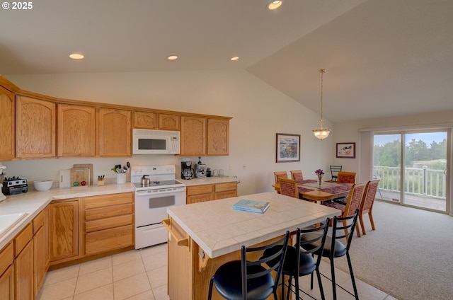 315 5th St NW Unit 101, Long Beach, WA 98631 - kitchen with white appliances, tile countertops, a center island, recessed lighting, and hanging light fixtures
