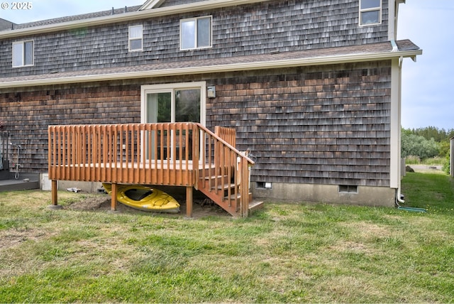 315 5th St NW Unit 101, Long Beach, WA 98631 - rear view of property featuring a yard and a wooden deck