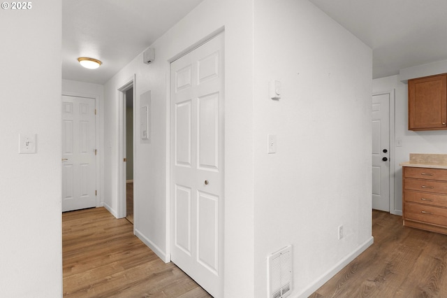 corridor featuring light wood-type flooring