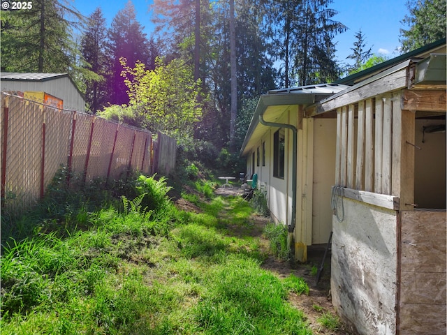 view of property exterior with fence