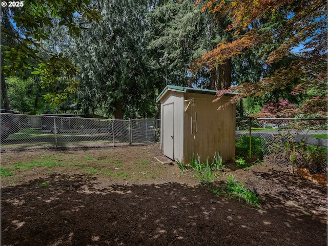view of shed featuring a fenced backyard