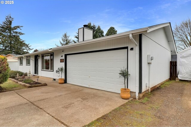 ranch-style home featuring a garage and a front yard