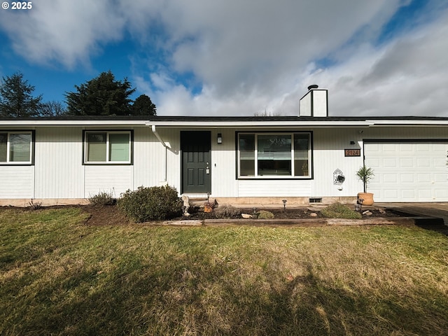 ranch-style house featuring a garage and a front lawn