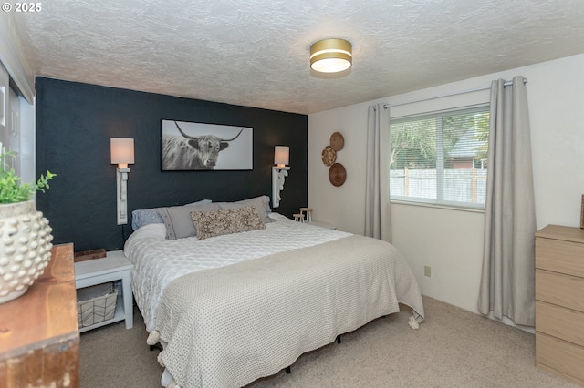 carpeted bedroom with a textured ceiling