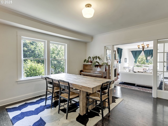 1630 SE 46th Ave, Portland, OR 97215 - dining room featuring crown molding, a chandelier, and wood finished floors