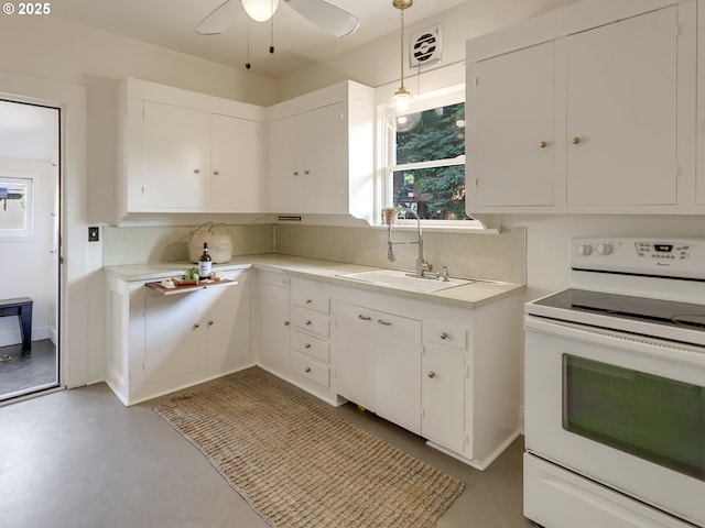 1630 SE 46th Ave, Portland, OR 97215 - kitchen with white range with electric stovetop, light countertops, white cabinetry, ceiling fan, and tasteful backsplash