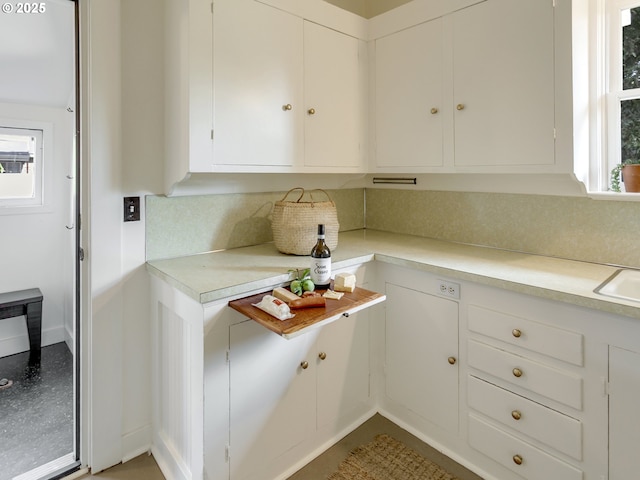 1630 SE 46th Ave, Portland, OR 97215 - kitchen with light countertops, tasteful backsplash, plenty of natural light, and white cabinets