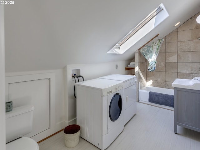 1630 SE 46th Ave, Portland, OR 97215 - laundry area with a skylight and washing machine and clothes dryer