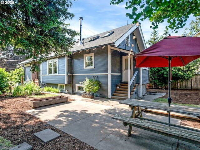 1630 SE 46th Ave, Portland, OR 97215 - back of house with roof with shingles and a patio area