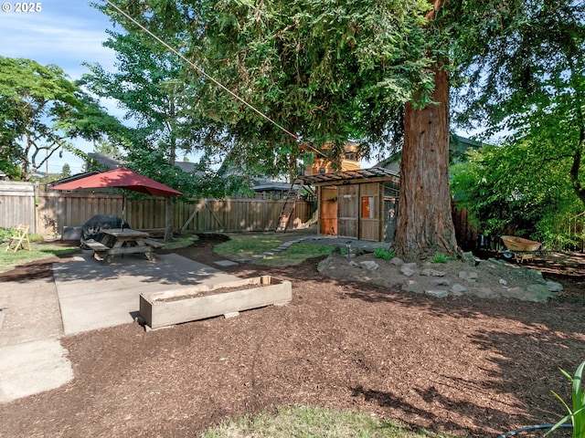 1630 SE 46th Ave, Portland, OR 97215 - fenced backyard with a patio and a storage shed