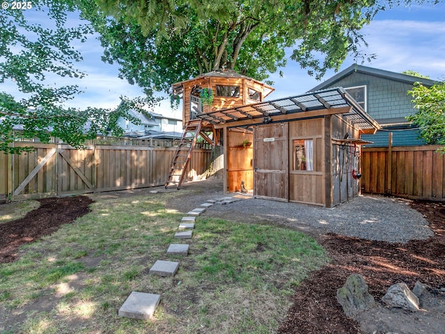 1630 SE 46th Ave, Portland, OR 97215 - fenced backyard with a storage unit