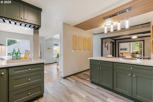 2251 SE 139th Ave, Portland, OR 97233 - kitchen featuring green cabinetry, light countertops, and light wood-style floors