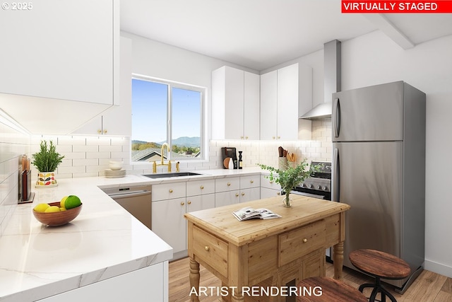 990 Forest Heights St, Sutherlin, OR 97479 - kitchen featuring appliances with stainless steel finishes, a sink, wall chimney range hood, light wood-type flooring, and tasteful backsplash