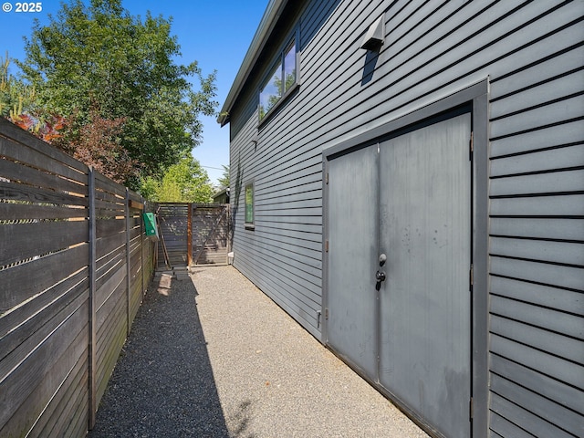 view of side of home with fence