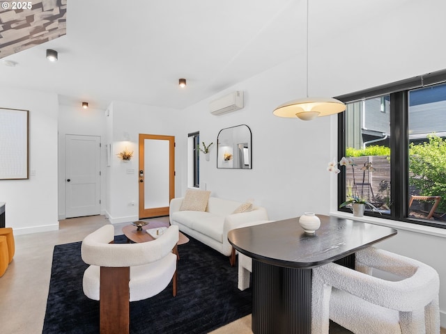 living room featuring an AC wall unit and baseboards