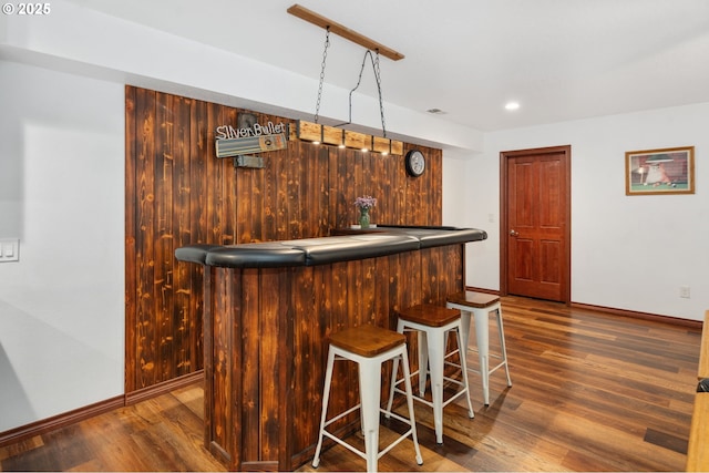 23072 SW Mansfield St, Sherwood, OR 97140 - indoor dry bar with wood finished floors, baseboards, and recessed lighting