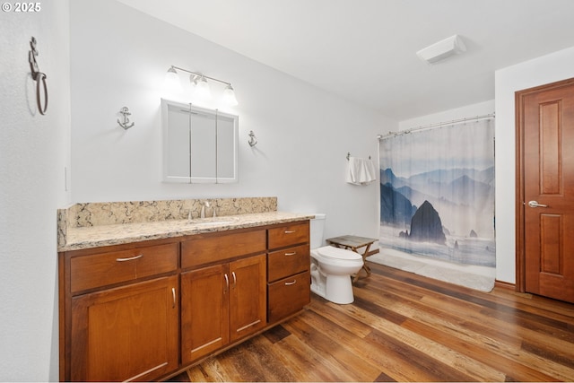 23072 SW Mansfield St, Sherwood, OR 97140 - bathroom with vanity, wood finished floors, toilet, and curtained shower