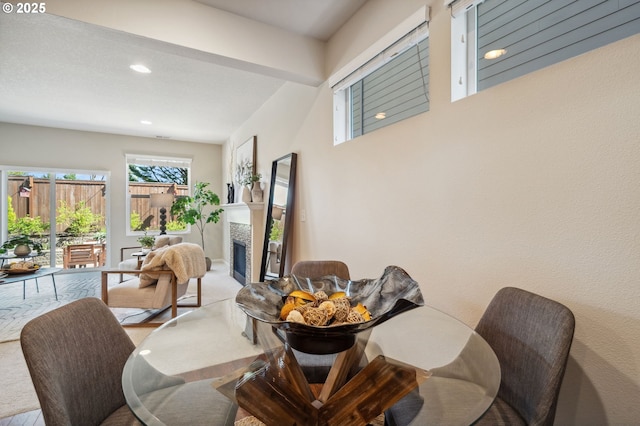 16125 SE Kingbird Dr, Clackamas, OR 97015 - dining space featuring a tiled fireplace and recessed lighting