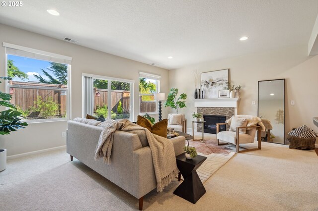 16125 SE Kingbird Dr, Clackamas, OR 97015 - living area featuring light colored carpet, a fireplace, recessed lighting, and baseboards