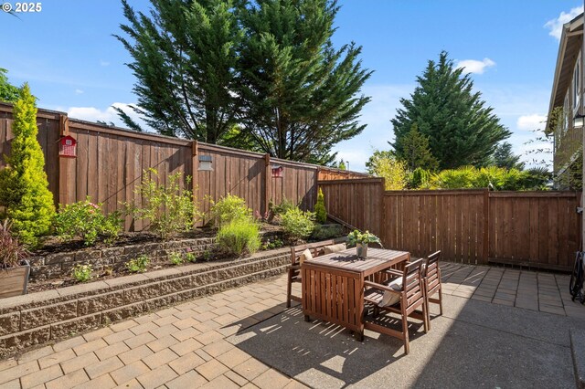 16125 SE Kingbird Dr, Clackamas, OR 97015 - fenced backyard featuring a patio area and outdoor dining space