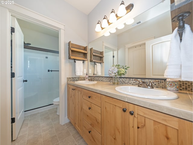 1058 E 16th St, Lafayette, OR 97127 - bathroom with double vanity, a shower stall, and backsplash