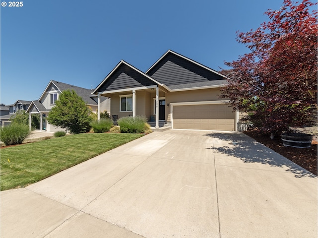 1058 E 16th St, Lafayette, OR 97127 - view of front of house featuring concrete driveway, an attached garage, a front yard, and covered porch