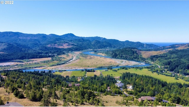 bird's eye view with a water and mountain view