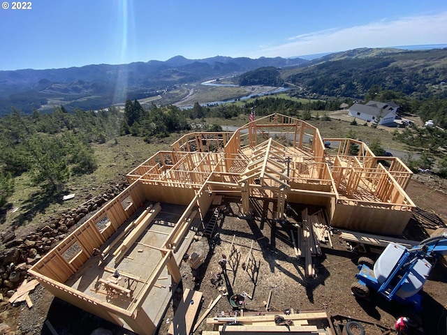 birds eye view of property featuring a mountain view