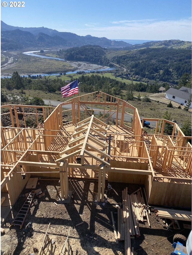 exterior space featuring a deck with mountain view