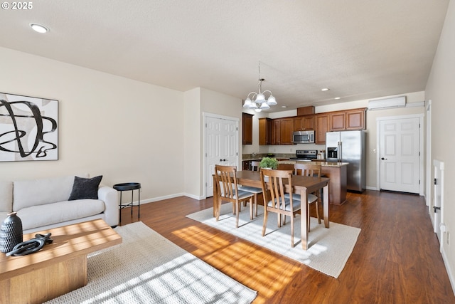 dining space with recessed lighting, a notable chandelier, dark wood finished floors, and baseboards