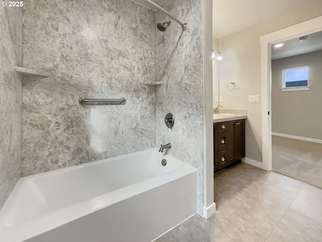 full bathroom featuring bathtub / shower combination, vanity, baseboards, and tile patterned floors