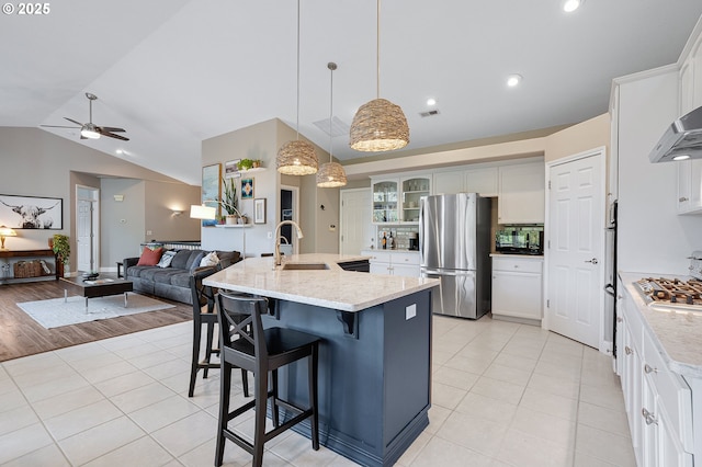 16904 SW Stellar Dr, Sherwood, OR 97140 - kitchen featuring appliances with stainless steel finishes, a sink, light tile patterned floors, lofted ceiling, and ceiling fan
