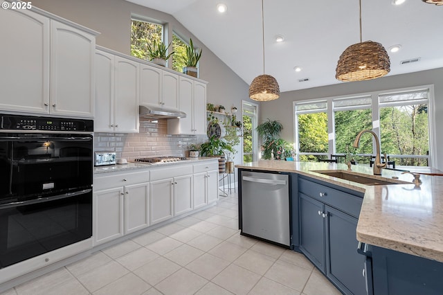16904 SW Stellar Dr, Sherwood, OR 97140 - kitchen with appliances with stainless steel finishes, a sink, white cabinets, blue cabinets, and decorative backsplash