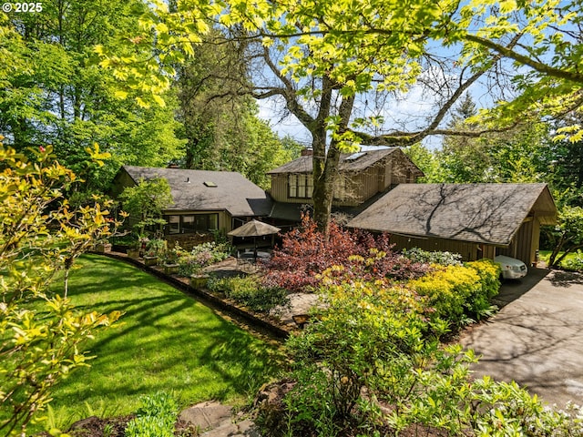 exterior space with driveway and an attached carport