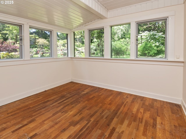 unfurnished sunroom featuring baseboards, wooden ceiling, lofted ceiling, and hardwood / wood-style floors