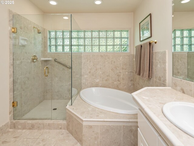 full bath with a shower stall, a bath, and a wealth of natural light